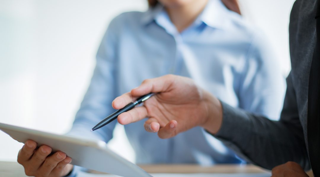 business-team-discussing-information-touchpad business-team-discussing-information-touchpad